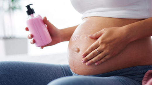 Expectant mother using pregnancy-safe skincare products